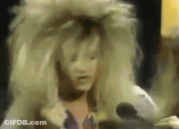 Woman In Wig Talking Into Microphone GIF