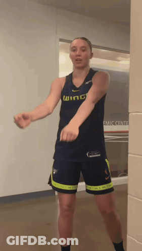 Woman In Wing Jersey And Shorts Dancing GIF