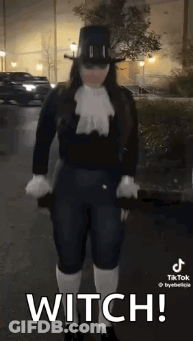 Woman In Witch Costume Holding Umbrella GIF
