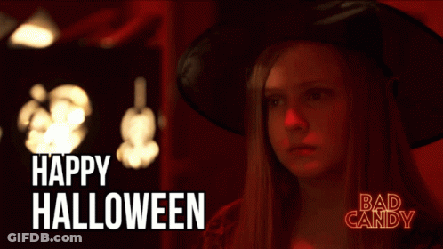 Woman In Witch Costume Saying Happy Halloween GIF