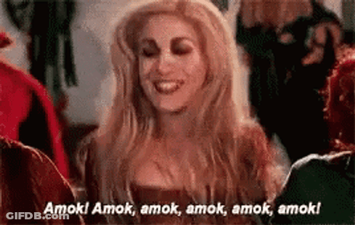Woman In Witch Costume Smiling Talking To Group GIF