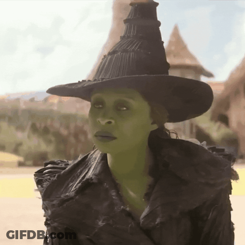 Woman In Witch Costume With Green Eyes GIF