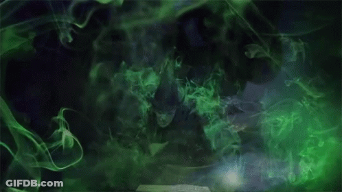Woman In Witch Costume With Green Smoke From Book GIF