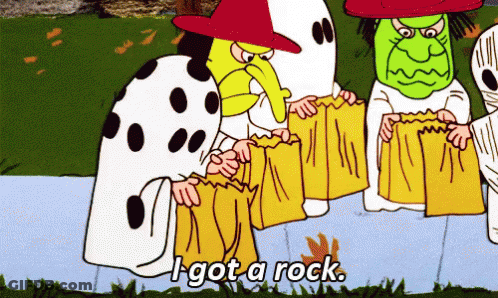 Woman In Witch Hat Next To Pumpkin GIF