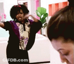 Woman In Woman-Print T-Shirt Cleaning Kitchen Counter GIF