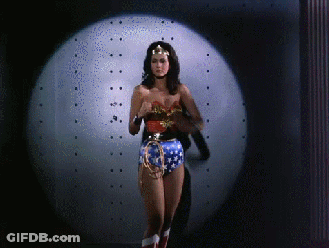 Woman In Wonder Woman Costume In Front Of Spotlight GIF