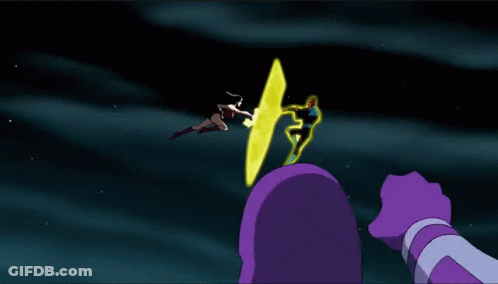 Woman In Wonder Woman Costume Next To Man In Purple Glove GIF