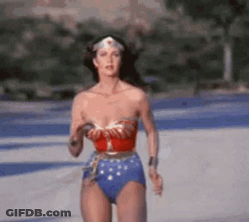 Woman In Wonder Woman Costume Running Across Road GIF