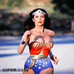 Woman In Wonder Woman Costume Running Down Street GIF