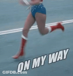 Woman In Wonder Woman Costume Running On Road GIF