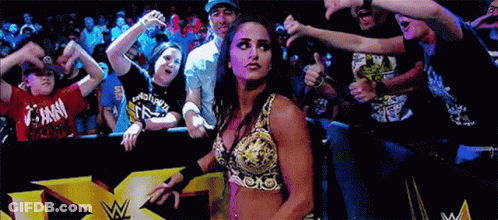 Woman In Wrestling Outfit Thumbs Up To Crowd GIF