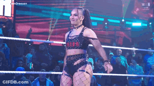 Woman In Wrestling Ring Before Crowd GIF