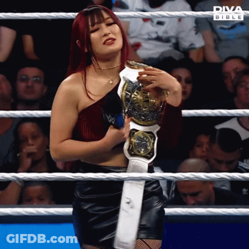 Woman In Wrestling Ring Holding Diva Bible Championship Belt GIF