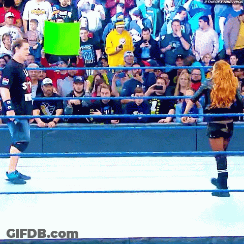 Woman In Wrestling Ring Holding I Love You Sign GIF