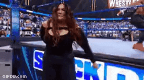Woman In Wrestling Ring On Stage GIF