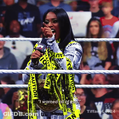 Woman In Wrestling Ring With Caution Tape GIF