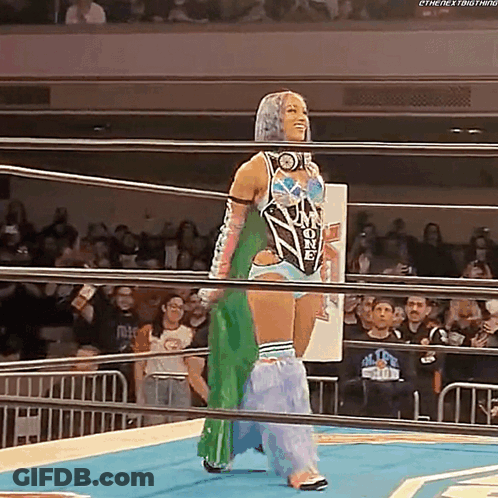 Woman In Wrestling Ring With Crowd GIF