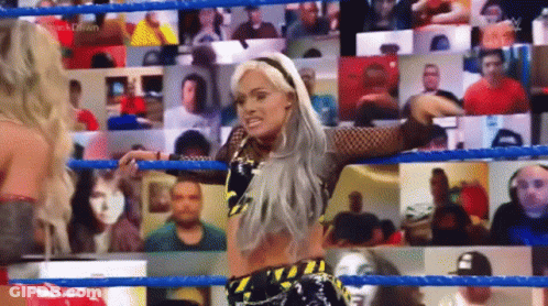 Woman In Wrestling Ring With Crowd GIF