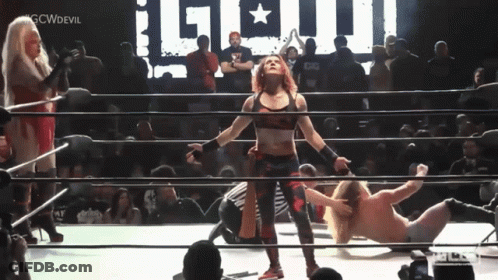 Woman In Wrestling Ring With GCWDevil Sign GIF