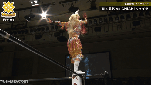 Woman In Wrestling Ring With Hashtag #Pw_Mg GIF