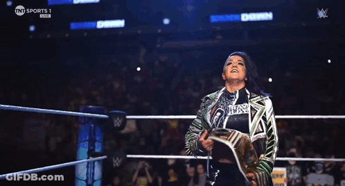 Woman In Wrestling Ring With Hungry Section Sign GIF