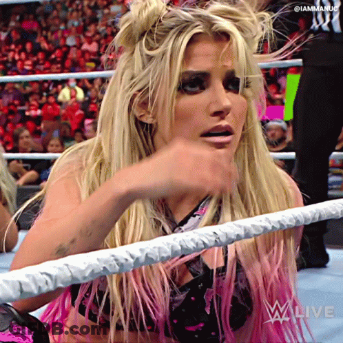 Woman In Wrestling Ring With Iammaniac Sign GIF