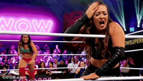 Woman In Wrestling Ring With Neon Sign Saying Now GIF