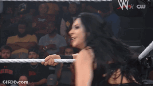 Woman In Wrestling Ring With NXT Sign GIF