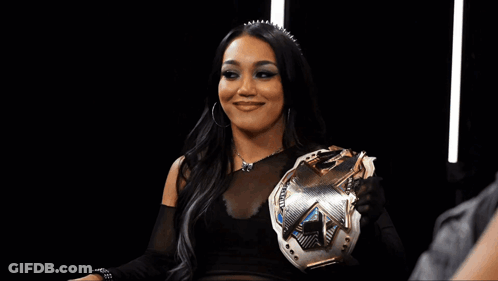 Woman In Wrestling Ring With NXT Sign GIF