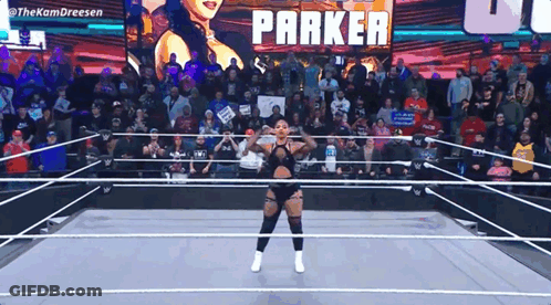 Woman In Wrestling Ring With Parker On Screen GIF