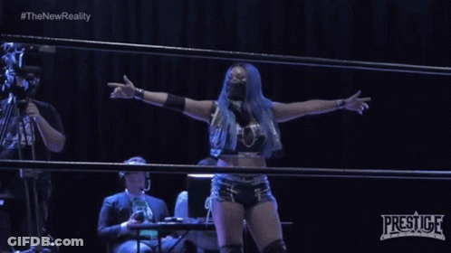 Woman In Wrestling Ring With Prestige Logo GIF