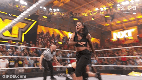 Woman In Wrestling Ring With Referee GIF