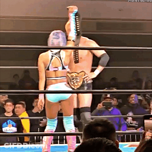 Woman In Wrestling Ring With The Next Thing Belt GIF
