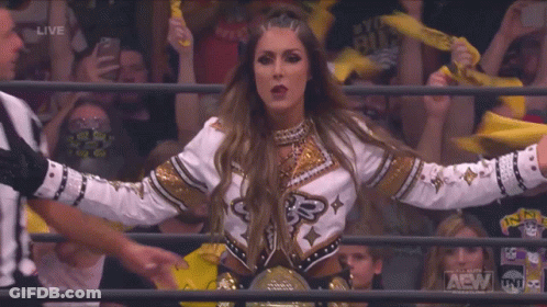 Woman In Wrestling Ring With TNT Logo GIF