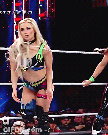 Woman In Wrestling Ring With Womenstag Titles GIF