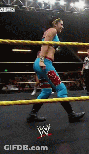 Woman In Wrestling Ring With WWE Logo GIF