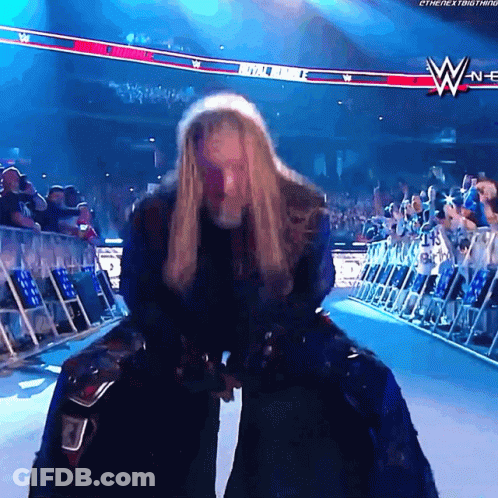 Woman In Wrestling Ring With WWE Logo GIF