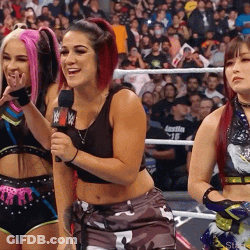 Woman In Wrestling Ring With WWE Mic GIF