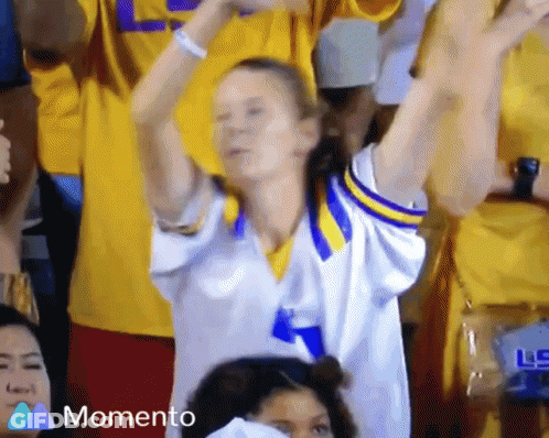 Woman In Yellow And Blue Jersey Cheering GIF
