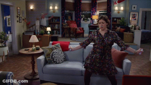 Woman In Yellow And Man In White Dancing GIF