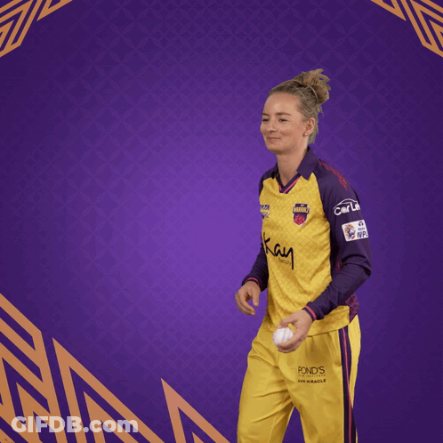 Woman In Yellow And Purple Jersey Saying Kay GIF