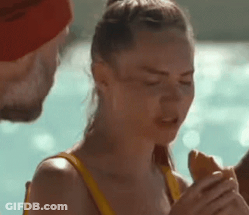 Woman In Yellow Bikini Eating Hot Dog GIF