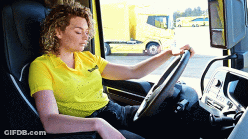 Woman In Yellow Bosch Shirt Driving Truck GIF