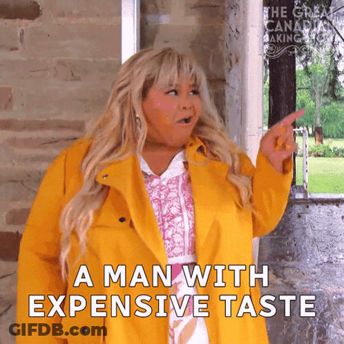 Woman In Yellow Coat Pointing At Man With Expensive Taste GIF