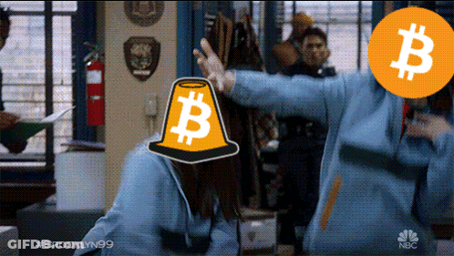 Woman In Yellow Cone With Letter B In Front Of NBC Logo GIF