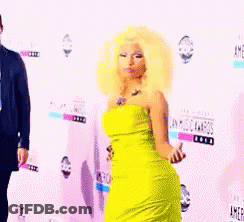 Woman In Yellow Dress At American Music Awards GIF
