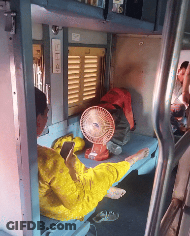 Woman In Yellow Dress Beside Red Fan Saying LG GIF