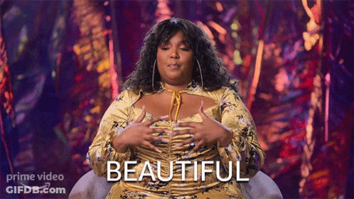 Woman In Yellow Dress By Beautiful Sign GIF