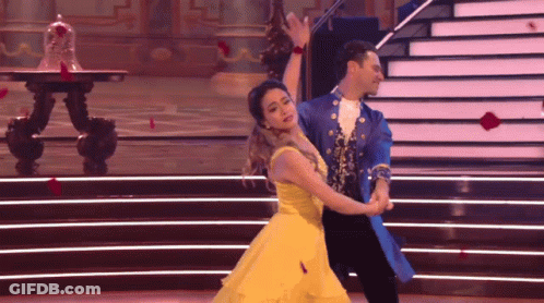 Woman In Yellow Dress Dancing With Man GIF