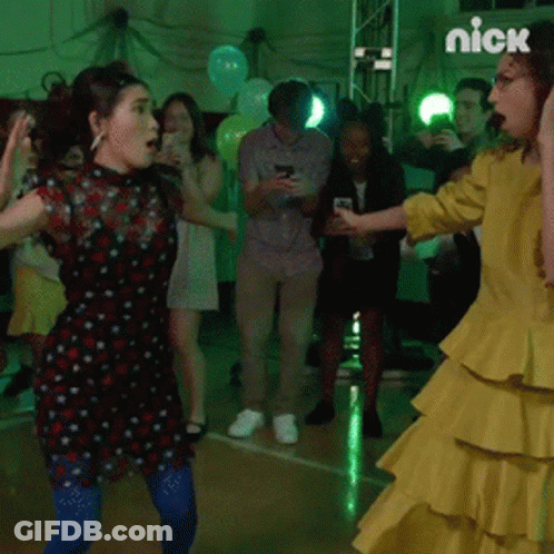 Woman In Yellow Dress Dancing With Nick Logo GIF